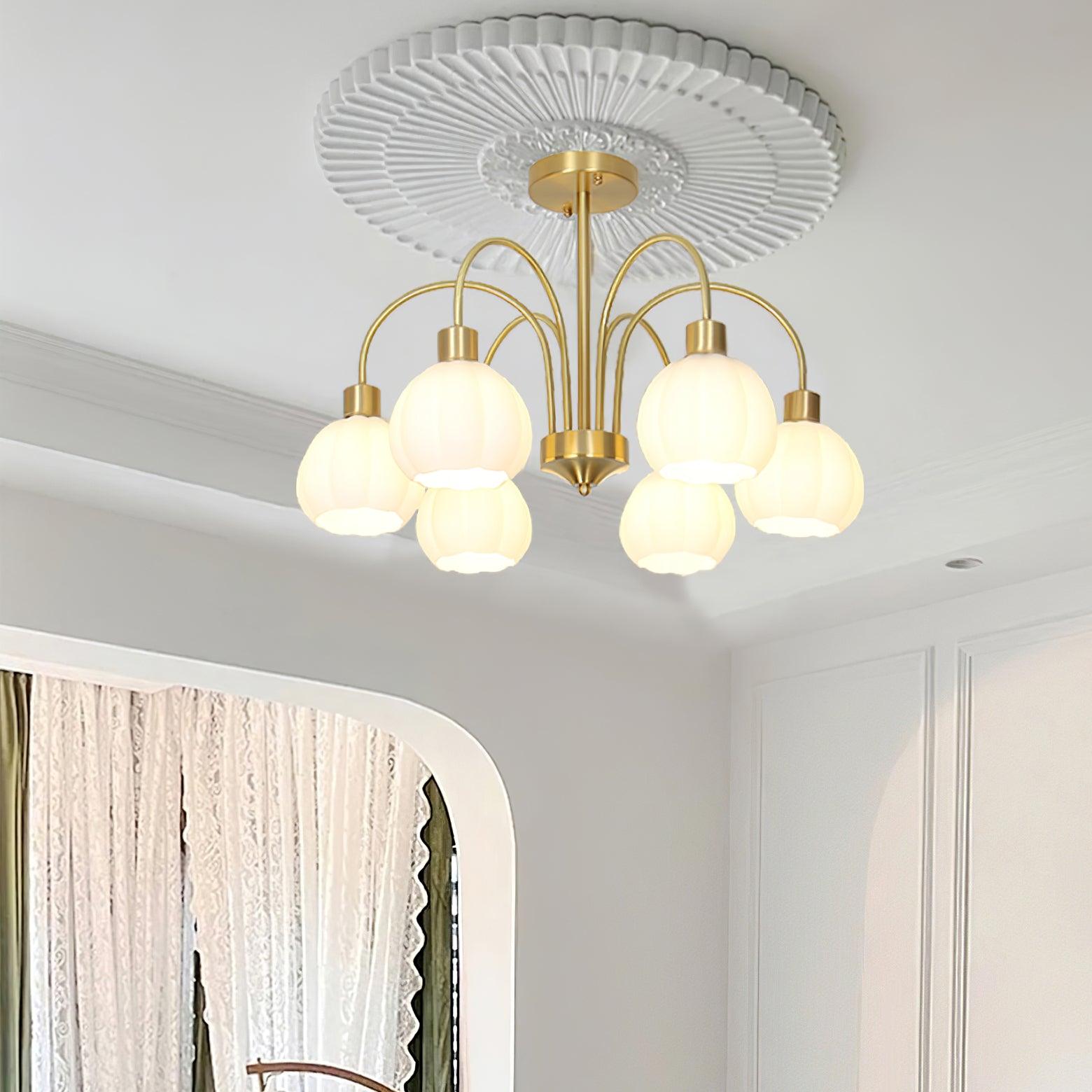 Lustre de vidro em formato de abóbora dourada